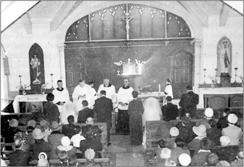 Title: Double wedding in old St Laurence's (Dolmen Centre). Description: Briege Elmore and James Dunne; John Elmore and Kathleen Boyle
Clergy: Fr. Patrick Breslin; Fr. John Reid; Canon Peter McDonnell; Fr. Pat Morgan. Source: Omeath - A look at the past - Volume 2